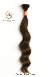 Brown human hair tress with a visible brand logo on a white background