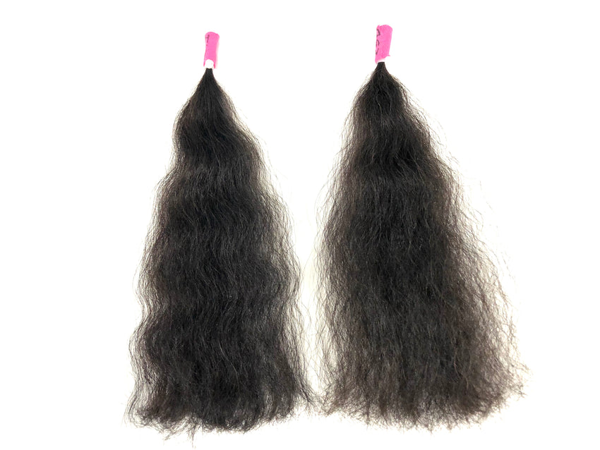 Two bundles of type 4 black hair tresses with pink clips on a white background